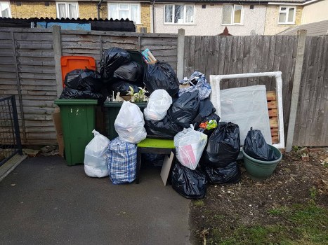 Bulky waste collection team removing large household items in a London street