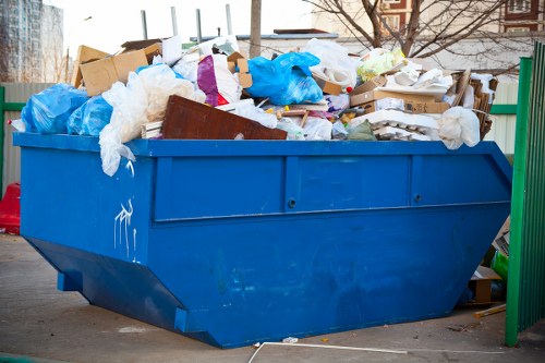 Rubbish removal team handling household waste in London